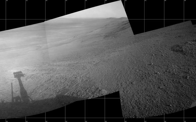 This July 7, 2017, scene from the Navcam on NASA's Opportunity Mars rover shows a view from the upper end of "Perseverance Valley" on the inner slope of Endeavour Crater's rim.  At left, the valley descends about 200 yards to the crater floor. In the middle, the crater rim extends southeastward.