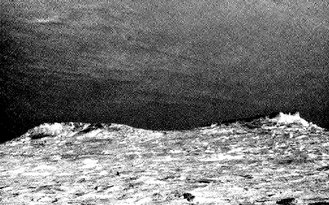Clouds drift across the sky above a  Martian horizon in this accelerated sequence of enhanced images taken on July  17, 2017, by the Navcam on NASA's Curiosity Mars rover.