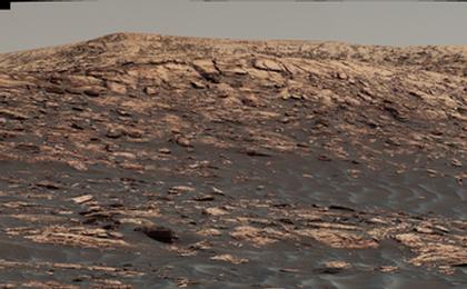 "Vera Rubin Ridge," a favored destination for NASA's Curiosity Mars rover even before the rover landed in 2012, rises near the rover nearly five years later in this panorama from Curiosity's Mastcam. The scene combines 23 images taken with the Mastcam's right-eye camera, on June 22, 2017.