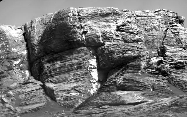 This view of "Vera Rubin Ridge" from the ChemCam instrument on NASA's Curiosity Mars rover shows sedimentary layers and fracture-filling mineral deposits. ChemCam's telescopic Remote Micro-Imager took the 10 component images of this scene on July 3, 2017, from a distance of about 377 feet.