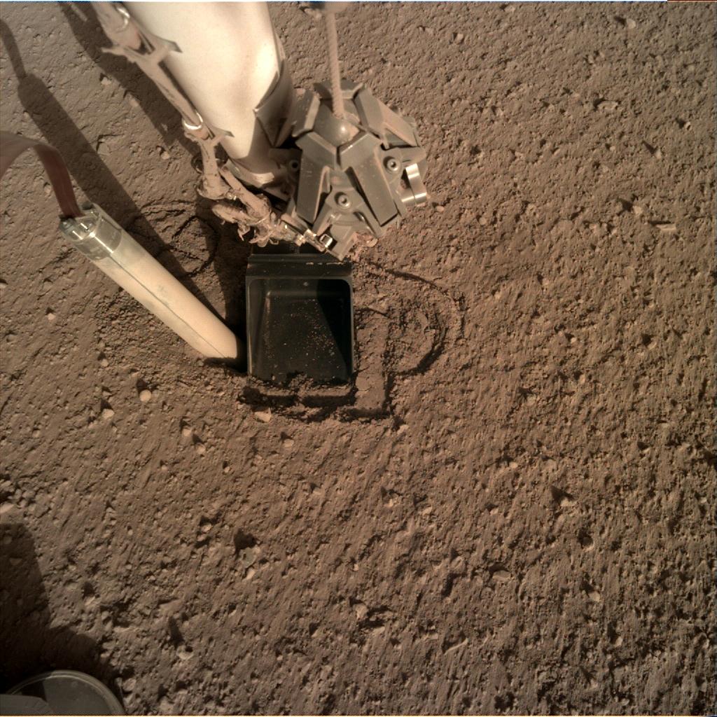 Nasa's Mars lander InSight acquired this image using its Instrument Deployment Camera on Sol 325
