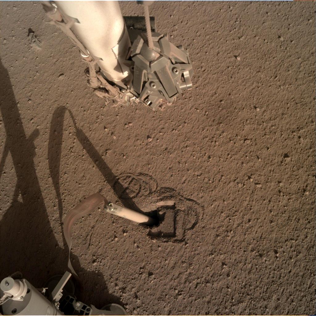 Nasa's Mars lander InSight acquired this image using its Instrument Deployment Camera on Sol 332