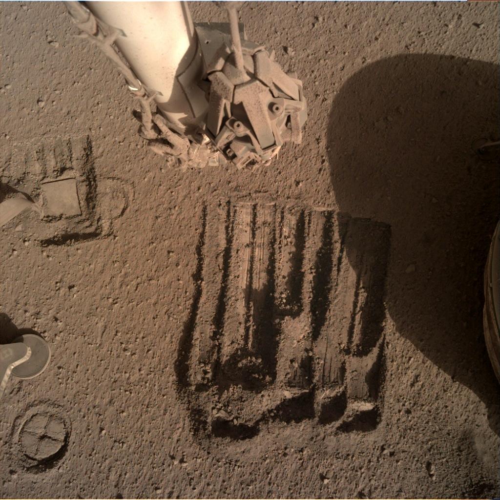 Nasa's Mars lander InSight acquired this image using its Instrument Deployment Camera on Sol 891