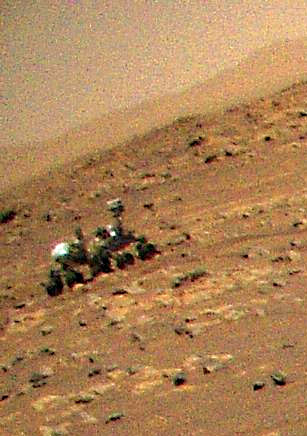 Zoomed in version of Mars Helicopter imaging the Perseverance rover.
