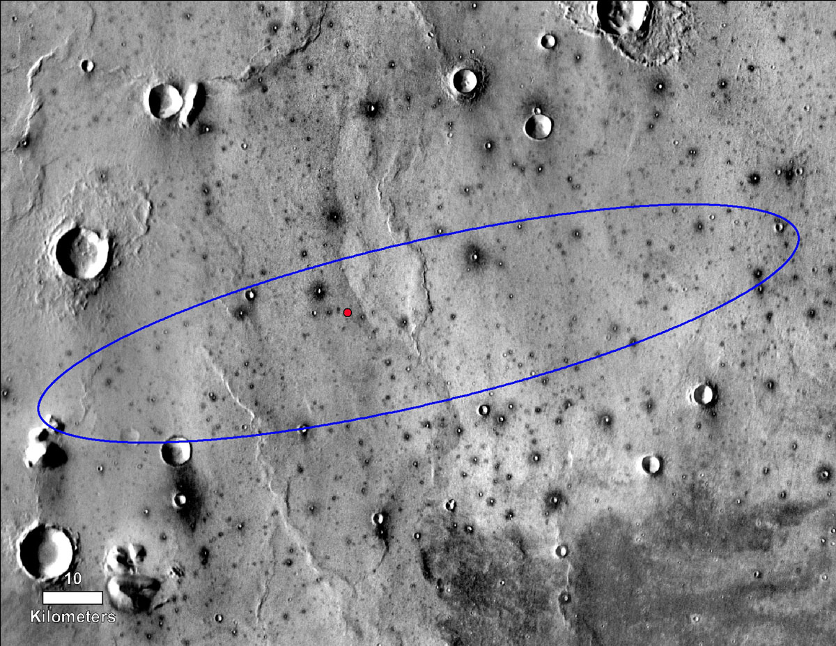 The red dot marks the final landing location of NASA's InSight lander in this annotated image of the surface of Mars, taken by the THEMIS camera on NASA's 2001 Mars Odyssey orbiter in 2015.