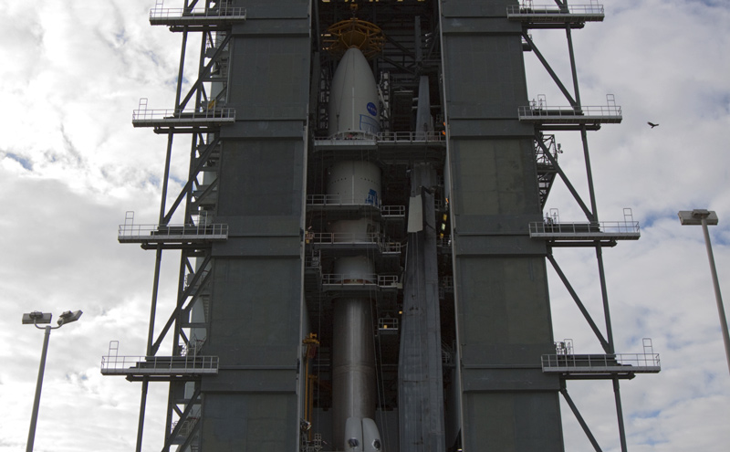 In the Vertical Integration Facility at Space Launch Complex 41, the payload fairing containing NASA's Mars Science Laboratory spacecraft was attached to its Atlas V rocket on Nov. 3, 2011.