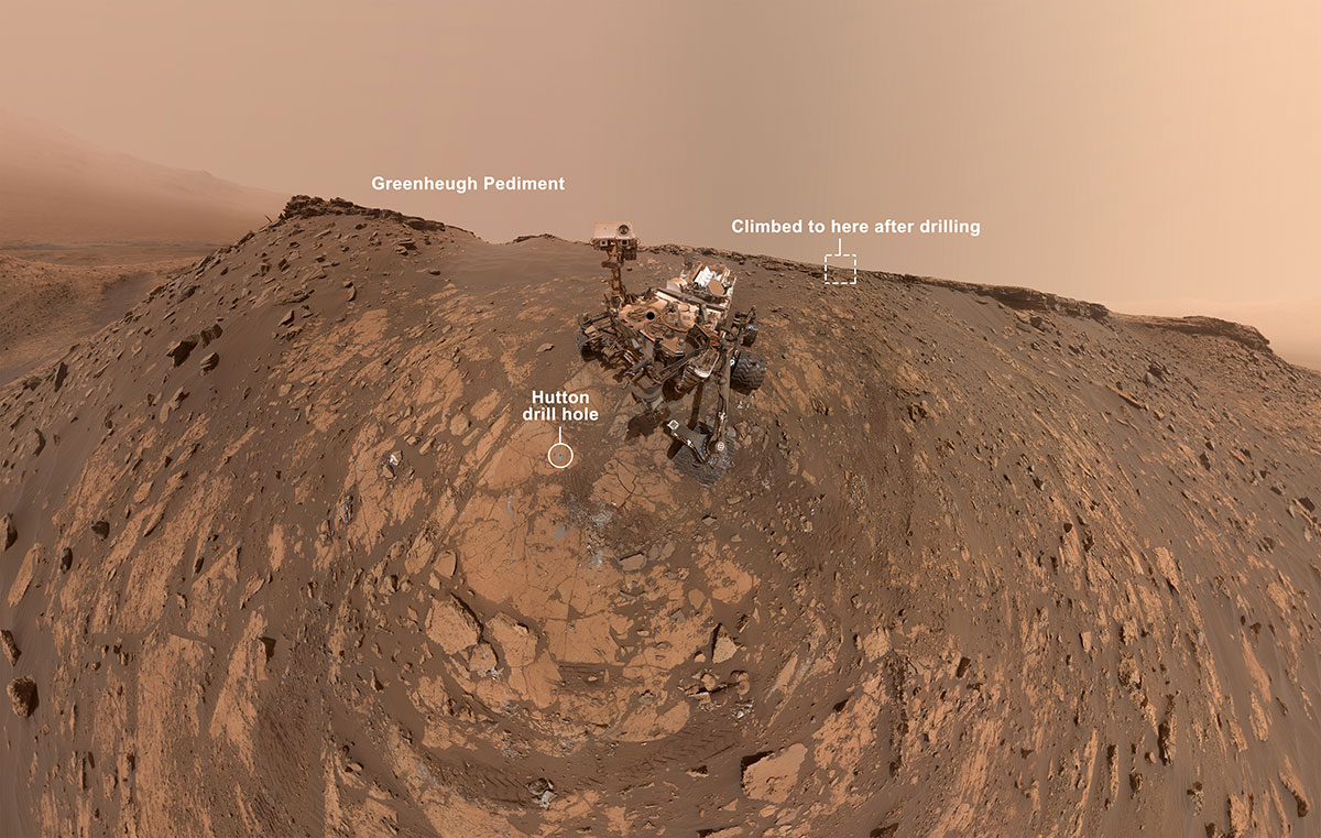 Annotated version indicating Greenheugh Pediment on the left, Hutton drill hole in the front of the rover, and the rover will head towards the top right of the image after drilling. 