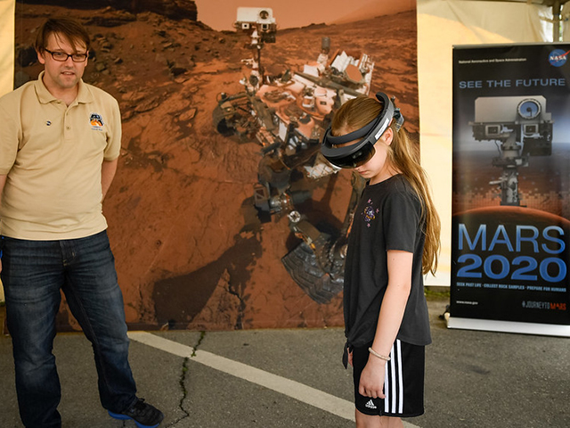 Girl taking a virtual tour of Mars