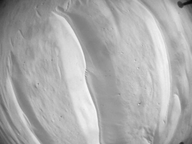 This image was taken by HELI_NAV onboard NASA's Mars rover Perseverance on Sol 673