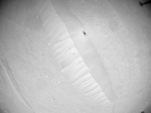 This image was taken by HELI_NAV onboard NASA's Mars rover Perseverance on Sol 902