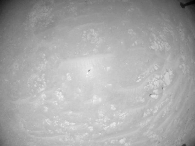 This image was taken by HELI_NAV onboard NASA's Mars rover Perseverance on Sol 933