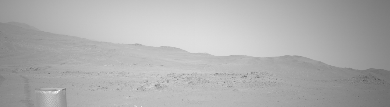NASA's Mars Perseverance rover acquired this image using its onboard Left Navigation Camera (Navcam). The camera is located high on the rover's mast and aids in driving. 

This image was acquired on June 7, 2026 (Sol 1883) at the local mean solar time of 11:45:14.