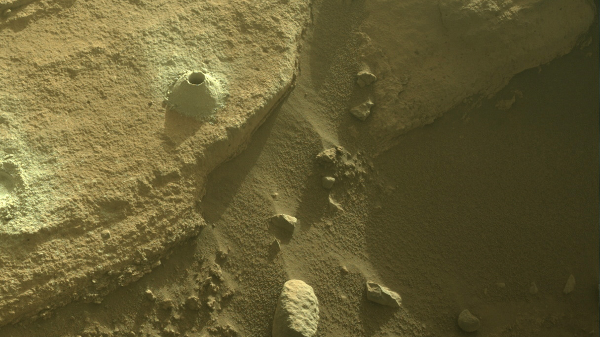 slide 6 - Image of drill hole created by NASA's Mars Perseverance rover.