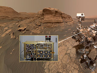 “Selfie” of the Curiosity rover with inset showing the SAM instrument prior to installation on the rover.