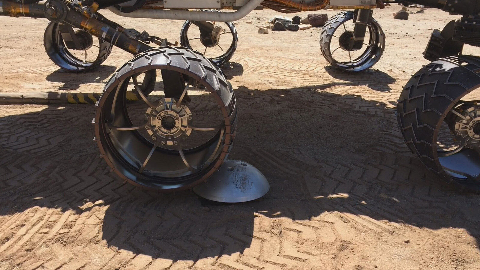 Traction Control Testing: A "scarecrow" rover at NASA's JPL drives over a sensor while testing a new driving algorithm. Engineers created the algorithm to reduce wheel wear on the Mars Curiosity rover. Credits: ASA/JPL-Caltech. Download image ›