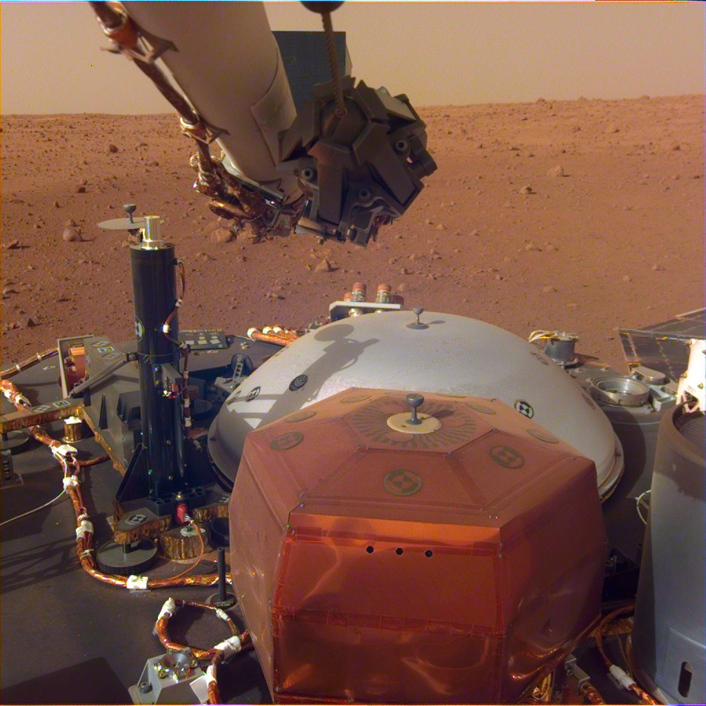 InSight's robotic-arm mounted Instrument Deployment Camera shows the instruments on the spacecraft's deck.