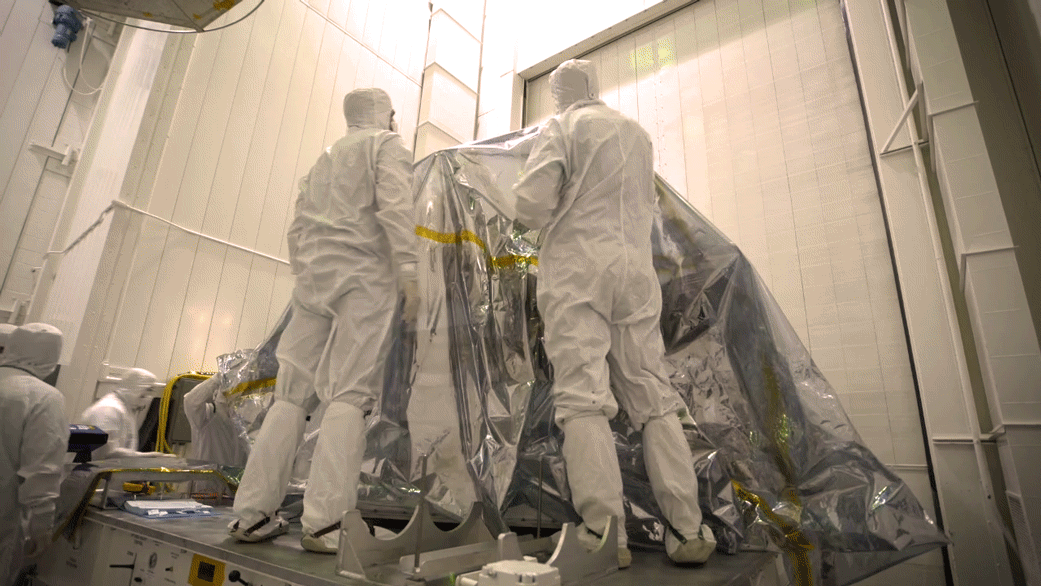 Mars 2020 Unwrapped and Ready for Testing: In time-lapse video bunny-suited engineers remove the inner layer of protective foil on NASA's Mars 2020 rover after it was moved to a different building at JPL for testing.