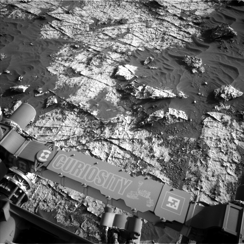 This black and white image was taken by Left Navigation Camera onboard NASA's Mars rover Curiosity on Sol 3149.