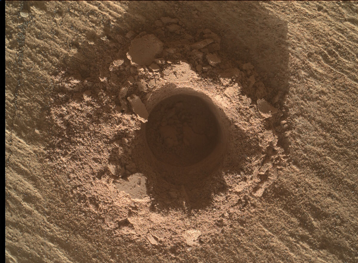 image of a drill hole on Mars.
