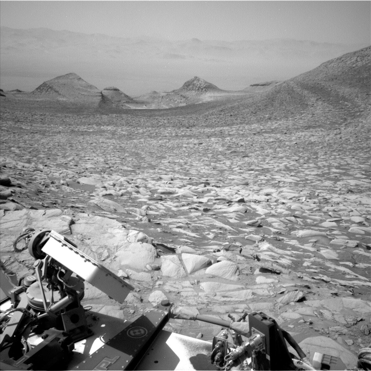 Navcam Left image of the road behind us from Sol 4096, depicting the light and dark rock layers we’ve been driving through. 