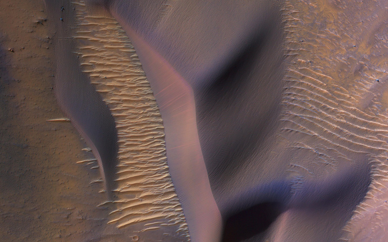 This image from NASA's Mars Reconnaissance Orbiter shows sand dunes on the slopes of Nectaris Montes within Coprates Chasma.