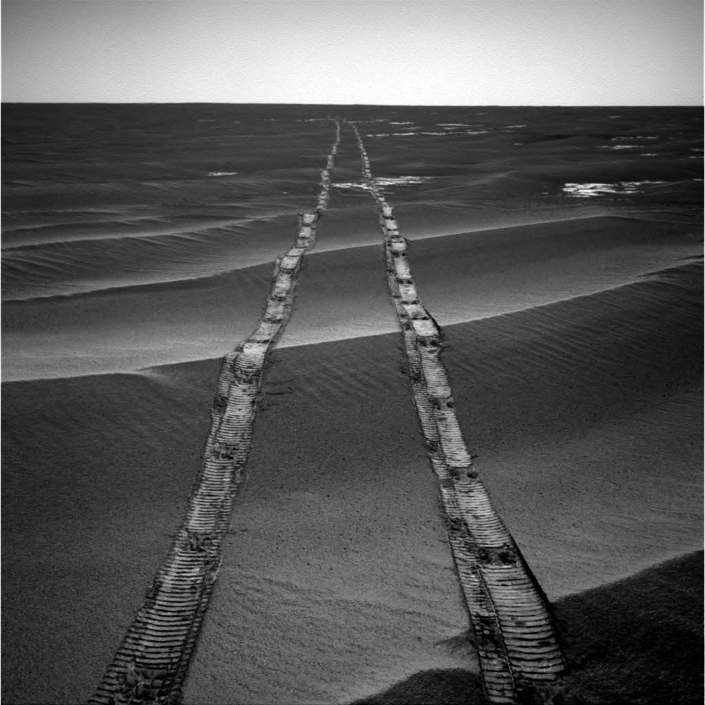 In this navigation camera raw image, NASA's Opportunity Rover looks back over its own tracks on Aug. 4, 2010. NASA's Jet Propulsion Laboratory, a division of Caltech in Pasadena, manages the Mars Exploration Rover Project for NASA's Science Mission Directorate, Washington.