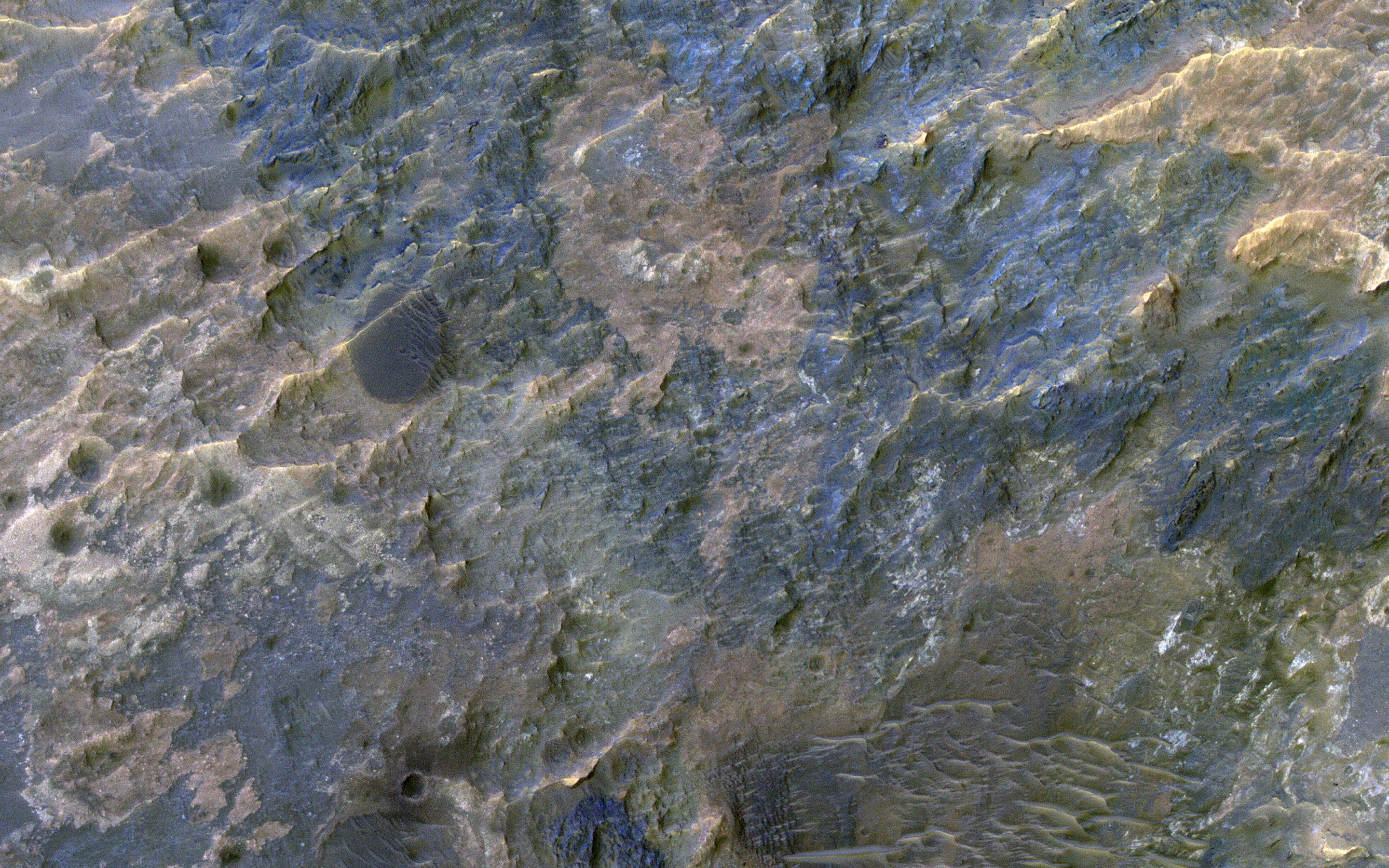 This image acquired on January 23, 2019 by NASAs Mars Reconnaissance Orbiter, shows the western portion of a well-preserved (recent) impact crater in Ladon Basin.