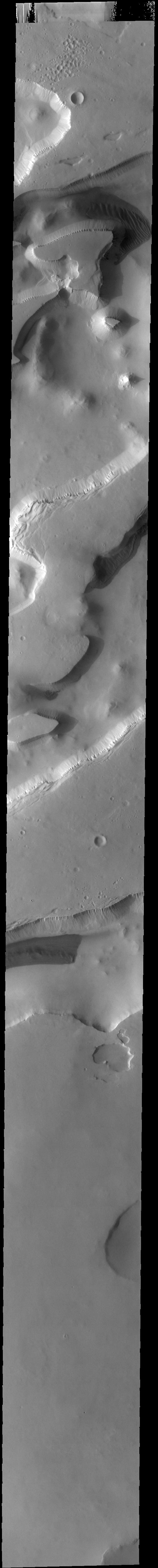 This image from NASAs Mars Odyssey shows part of Sisyphi Cavi located in Noachis Terra near the south polar cap.