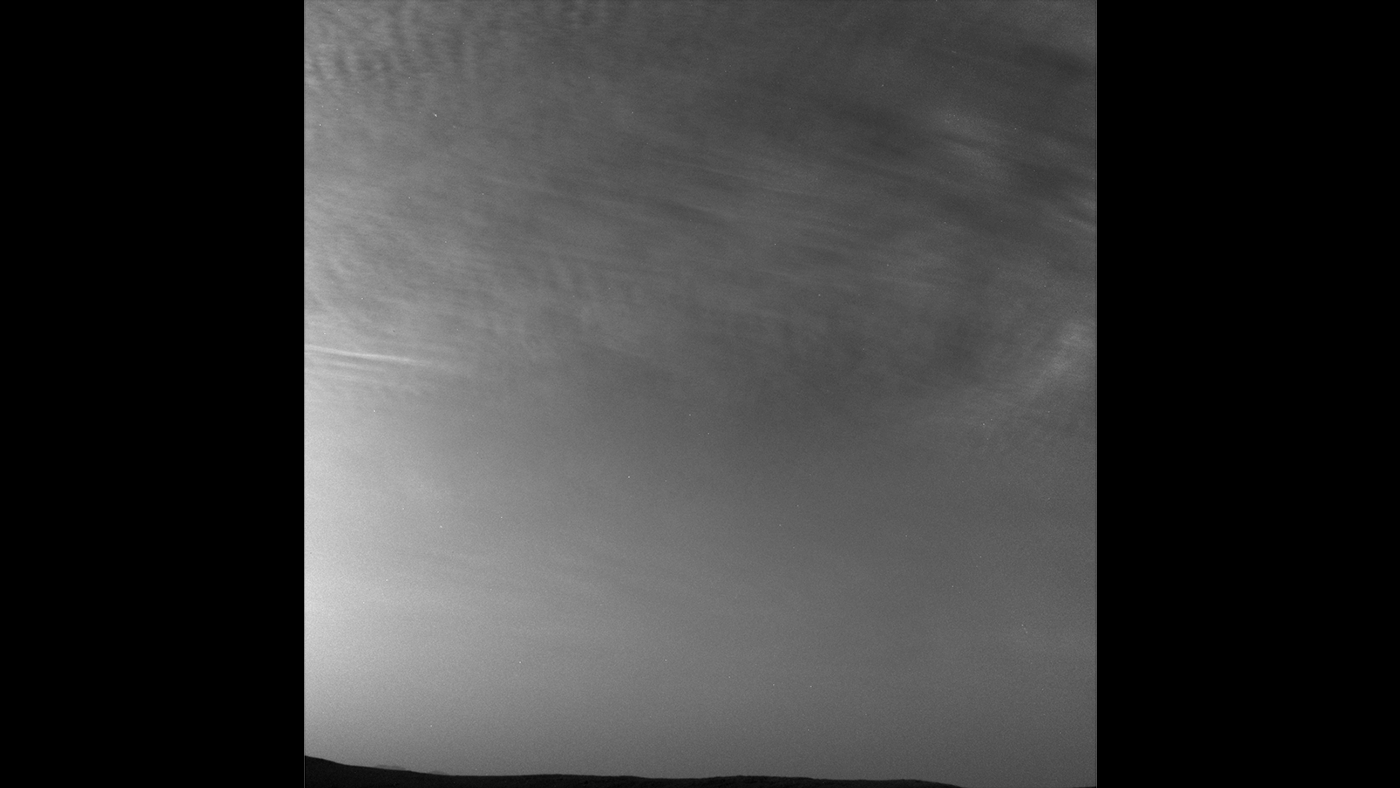 NASA's Curiosity Mars rover imaged these drifting clouds on May 7, 2019, the 2,400th Martian day, or sol, of the mission, using its Navigation Cameras (Navcams).