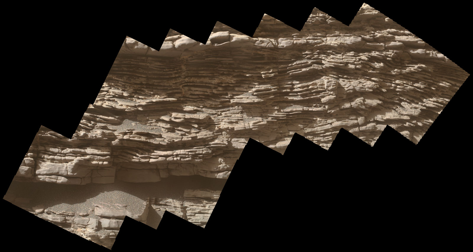 This mosaic of images shows layers of sediment on a boulder-sized rock called "Strathdon," as seen by the Mars Hand Lens Imager (MAHLI) camera carried by NASA's Curiosity rover. The images were taken on July 10, 2019, the 2,462nd Martian day, or sol, of the mission.