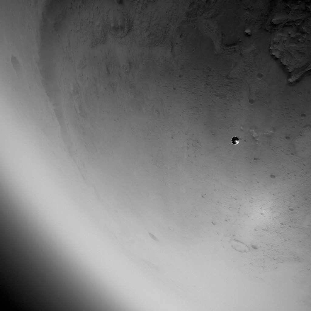 This image was taken by the Lander Vision System Camera (LCAM) of NASA’s Perseverance rover as the rover descended through the Martian atmosphere on Feb. 18, 2021. The camera served as part of the Terrain-Relative Navigation system, a kind of autopilot that helps the spacecraft avoid hazards as it lands.