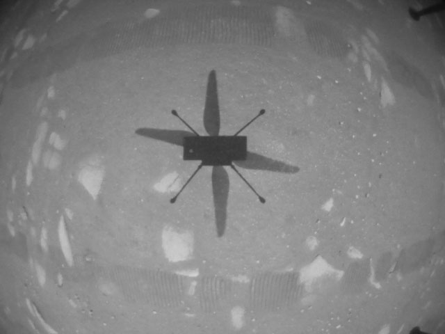 NASA’s Ingenuity Mars Helicopter took this shot while hovering over the Martian surface on April 19, 2021, during the first instance of powered, controlled flight on another planet. It used its navigation camera, which autonomously tracks the ground during flight.