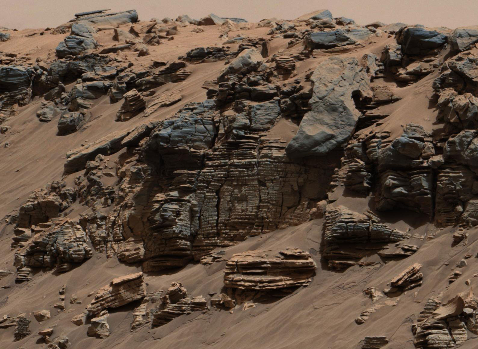 This evenly layered rock photographed by the Mast Camera (Mastcam) on NASA's Curiosity Mars Rover shows a pattern typical of a lake-floor sedimentary deposit not far from where flowing water entered a lake.