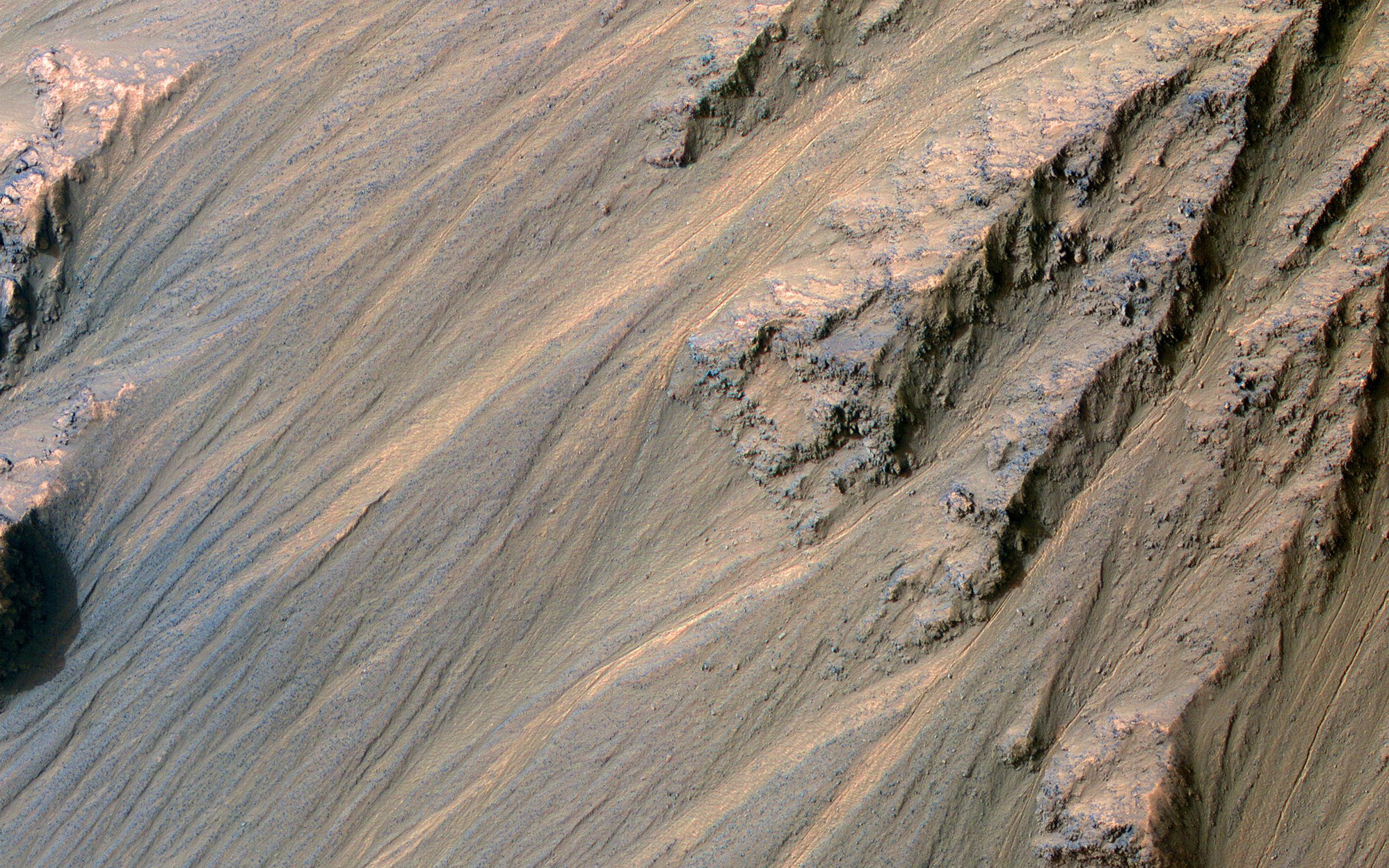 This image acquired on January 22, 2022 by NASAs Mars Reconnaissance Orbiter shows pristine-looking gullies in equatorial Valles Marineris.