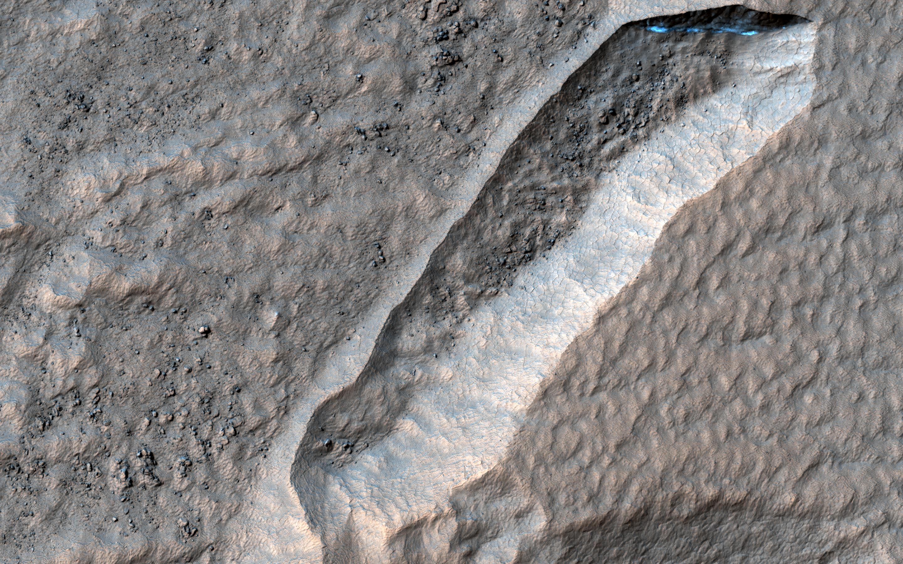 This image acquired on August 14, 2022 by NASAs Mars Reconnaissance Orbiter shows a curious depression with zig-zag walls on the north rim of Secchi Crater.