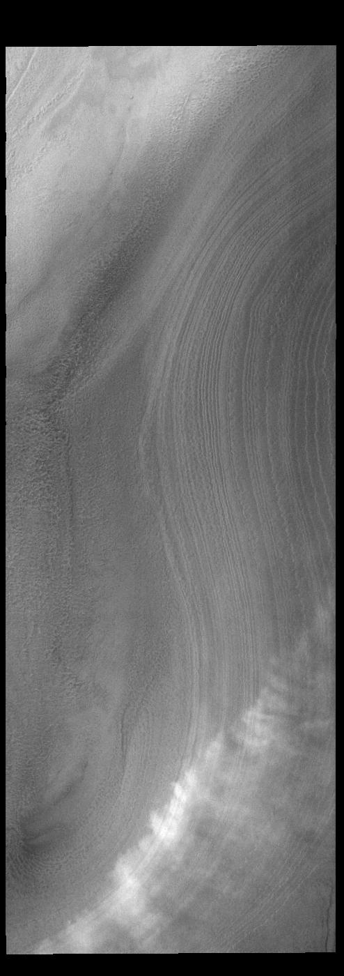 This image from NASAs Mars Odyssey shows a line of clouds over the south polar cap.