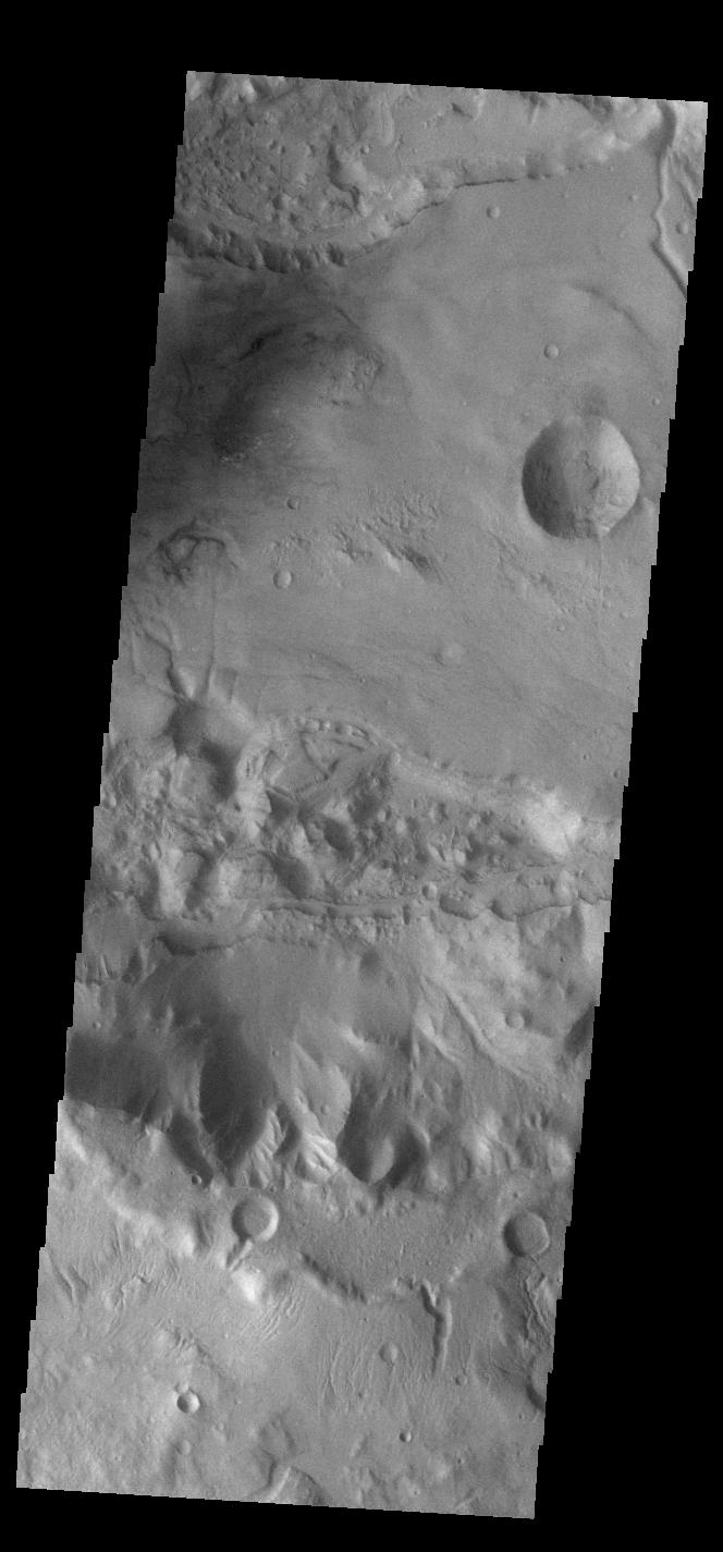 This image from NASAs Mars Odyssey shows a portion of Sirenum Fossae. The linear features are tectonic graben. Graben are formed by extension of the crust and faulting.