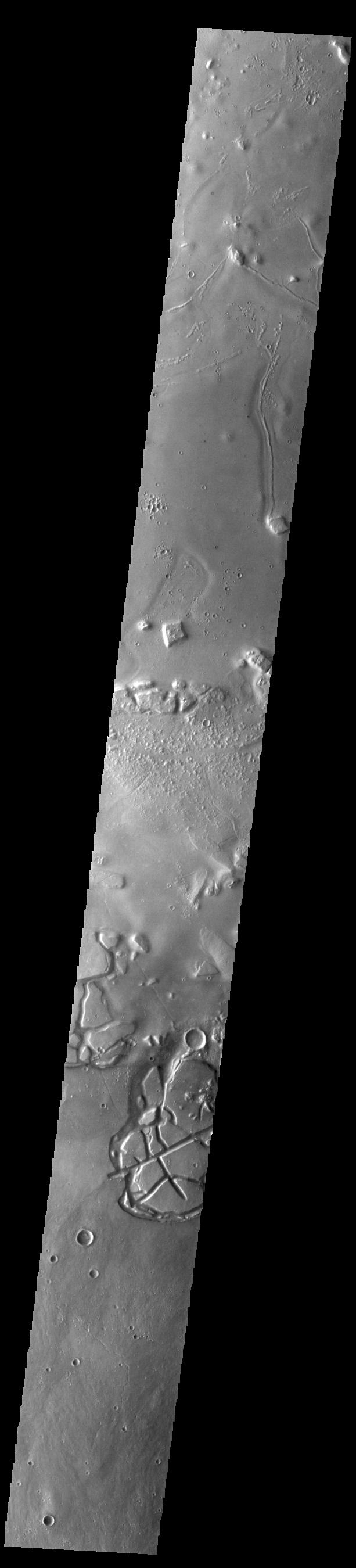 This image from NASAs Mars Odyssey shows Galaxias Chaos, located on the northern border of the Elyisum volcanic complex.