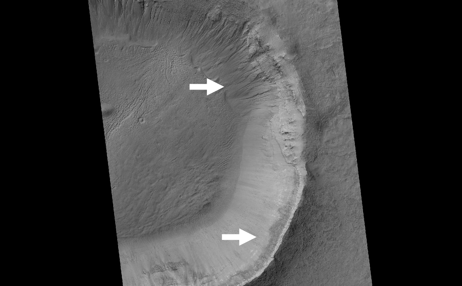 This image contrasts gullies and recurring warm-season slope flows appearing in the same crater, in the middle southern latitudes of Mars.