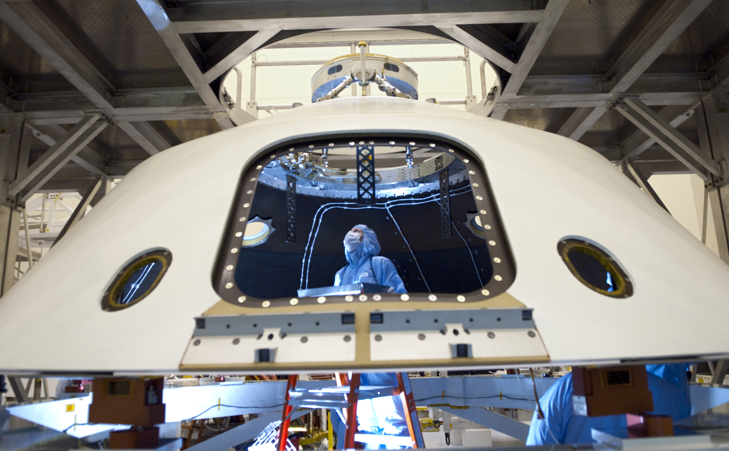 In the Payload Hazardous Servicing Facility at NASA's Kennedy Space Center in Florida, technicians process the backshell for NASA's Mars Science Laboratory (MSL).