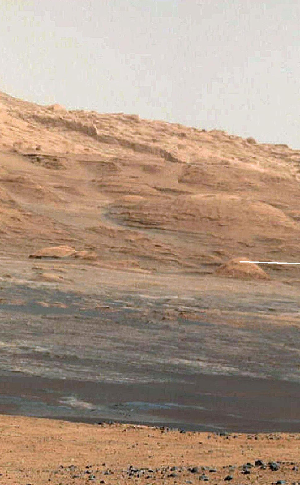 This image (cut out from a mosaic) shows the view from the landing site of NASA's Curiosity rover toward the lower reaches of Mount Sharp, where Curiosity is likely to begin its ascent through hundreds of feet (meters) of layered deposits.