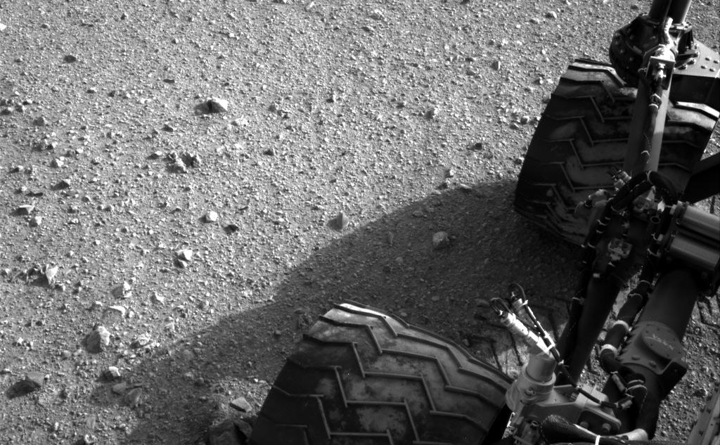 Soil clinging to the right middle and rear wheels of NASA's Mars rover Curiosity can be seen in this image taken by the Curiosity's Navigation Camera after the rover's third drive on Mars.