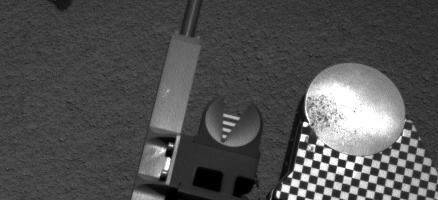 Sample material from the fourth scoop of Martian soil collected by NASA's Mars rover Curiosity is on the rover's observation tray in this image taken during the mission's 78th Martian day, or sol, (Oct. 24, 2012) by Curiosity's left Navigation Camera.