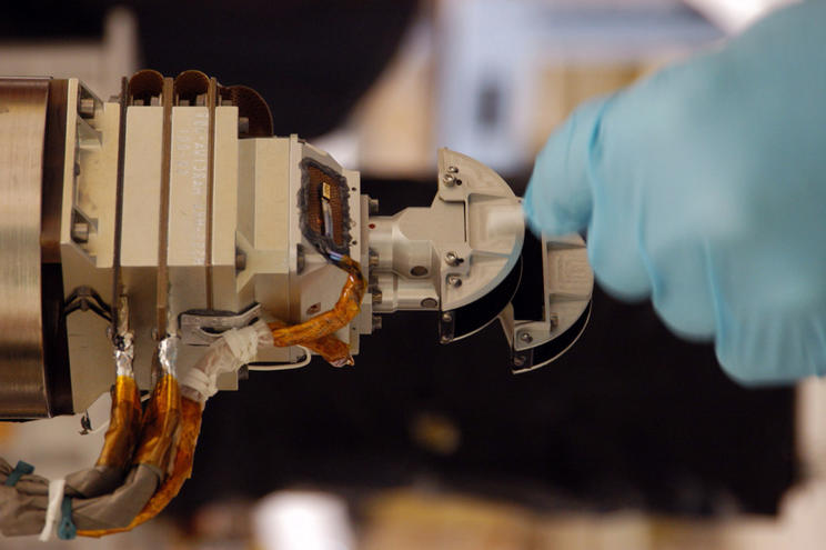 The Mars Color Imager (MARCI), shown here with a gloved hand for scale, is designed to produce a global map to help characterize daily, seasonal and year-to-year variations in Mars' climate, providing a daily weather report for Mars.