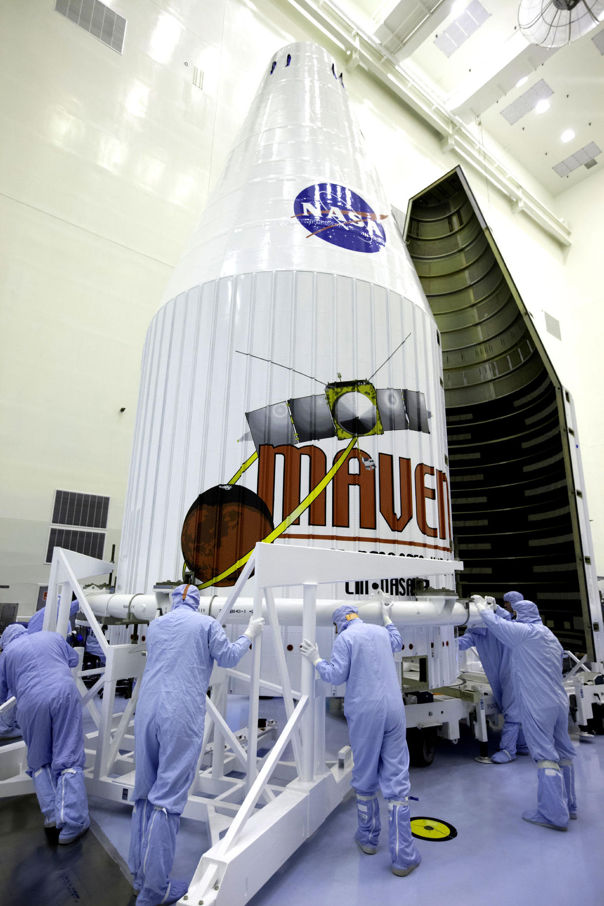 The payload fairing for the Mars Atmosphere and Volatile Evolution, or MAVEN, spacecraft arrives at the Payload Hazardous Servicing Facility at NASA's Kennedy Space Center in Florida.