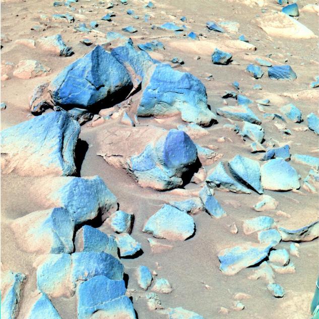 This false-color image taken by Spirit shows a group of darker rocks dubbed "Toltecs," lying to the southeast of the rover's position.