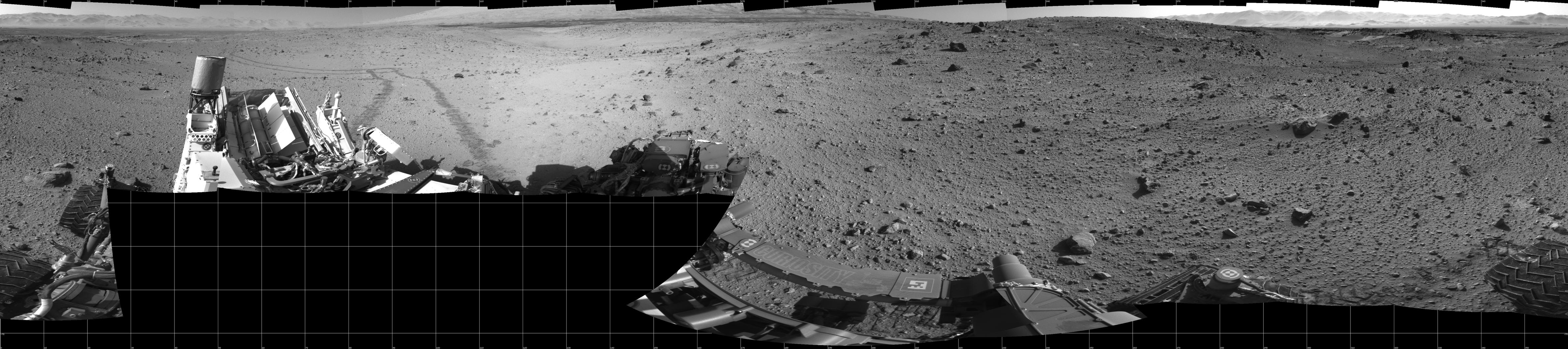 This mosaic of images from the Navigation Camera (Navcam) on NASA's Mars rover Curiosity shows the terrain surrounding the rover's position on the 524th Martian day, or sol, of the mission (Jan. 26, 2014). The images were taken right after Curiosity completed a drive of about 79 feet (24 meters).