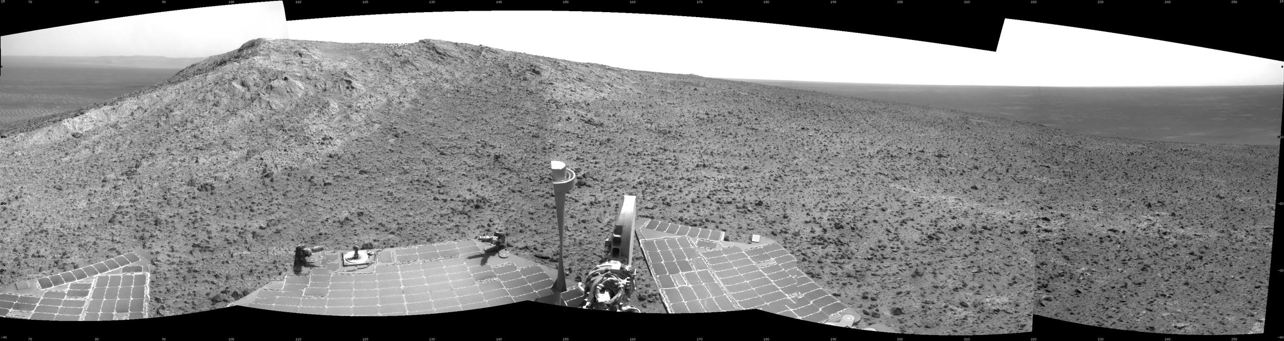 NASA's Mars Exploration Rover Opportunity recorded this view of the summit of "Cape Tribulation," on the western rim of Endeavour Crater on the day before the rover drove to the top. This crest is about 440 feet higher in elevation than the plain surrounding the crater.