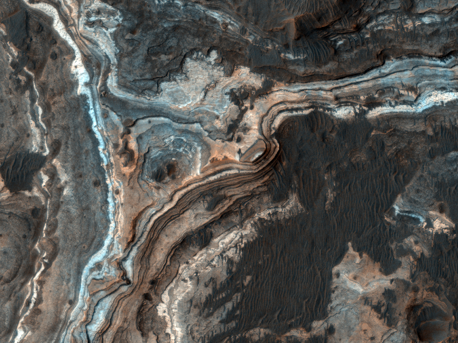 This image shows part of Ladon Vallis, a long outflow channel found in the Southern Highlands on Mars.