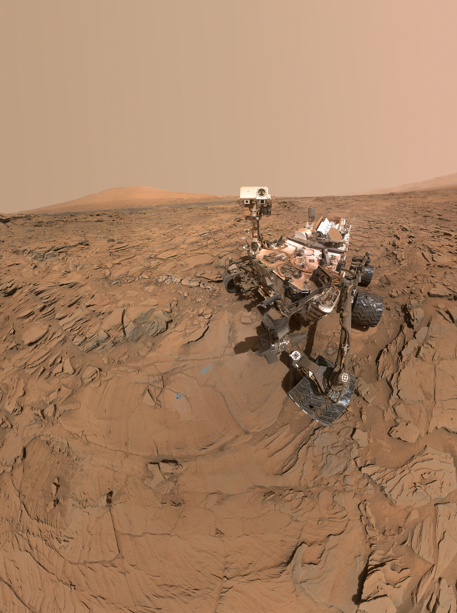 This May 11, 2016, self-portrait of NASA's Curiosity Mars rover shows the vehicle at the "Okoruso" drilling site on lower Mount Sharp's "Naukluft Plateau."  The scene is a mosaic of multiple images taken with the arm-mounted Mars Hands Lens Imager (MAHLI).